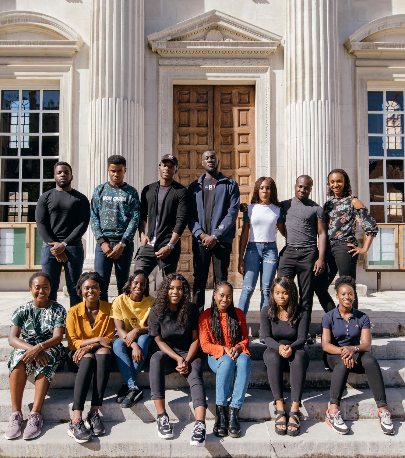 Stormzy with members of the Cambridge African Caribbean Society outside Senate House